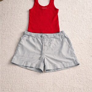 Light green cloth and stone shorts with Suzette Collection red tank top